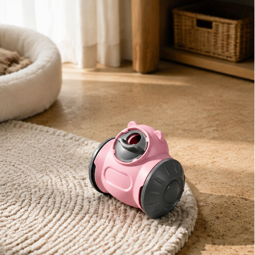 Treat-dispensing rolling toy on a soft rug beside a pet bed