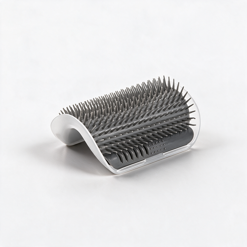 Cat self-grooming corner brush on a white studio background